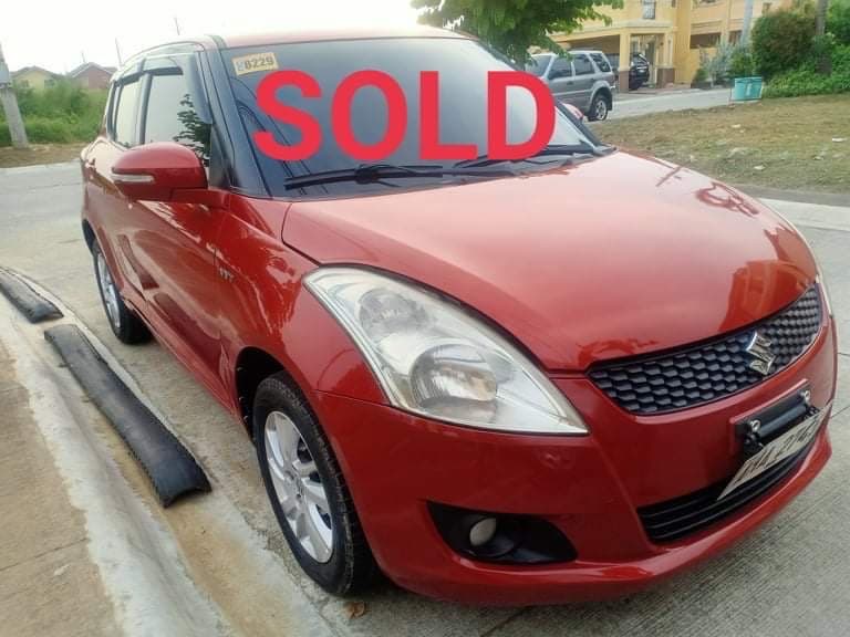 Red Suzuki Swift photo