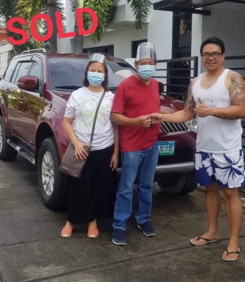 Maroon Mitsubishi Montero Sport photo